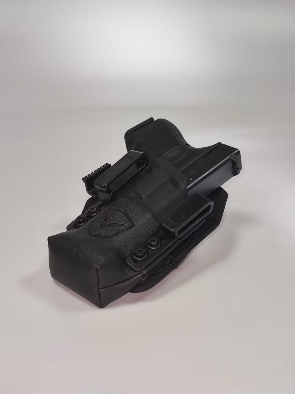 SENTINEL IWB holster angled view showing muzzle cap and belt clips